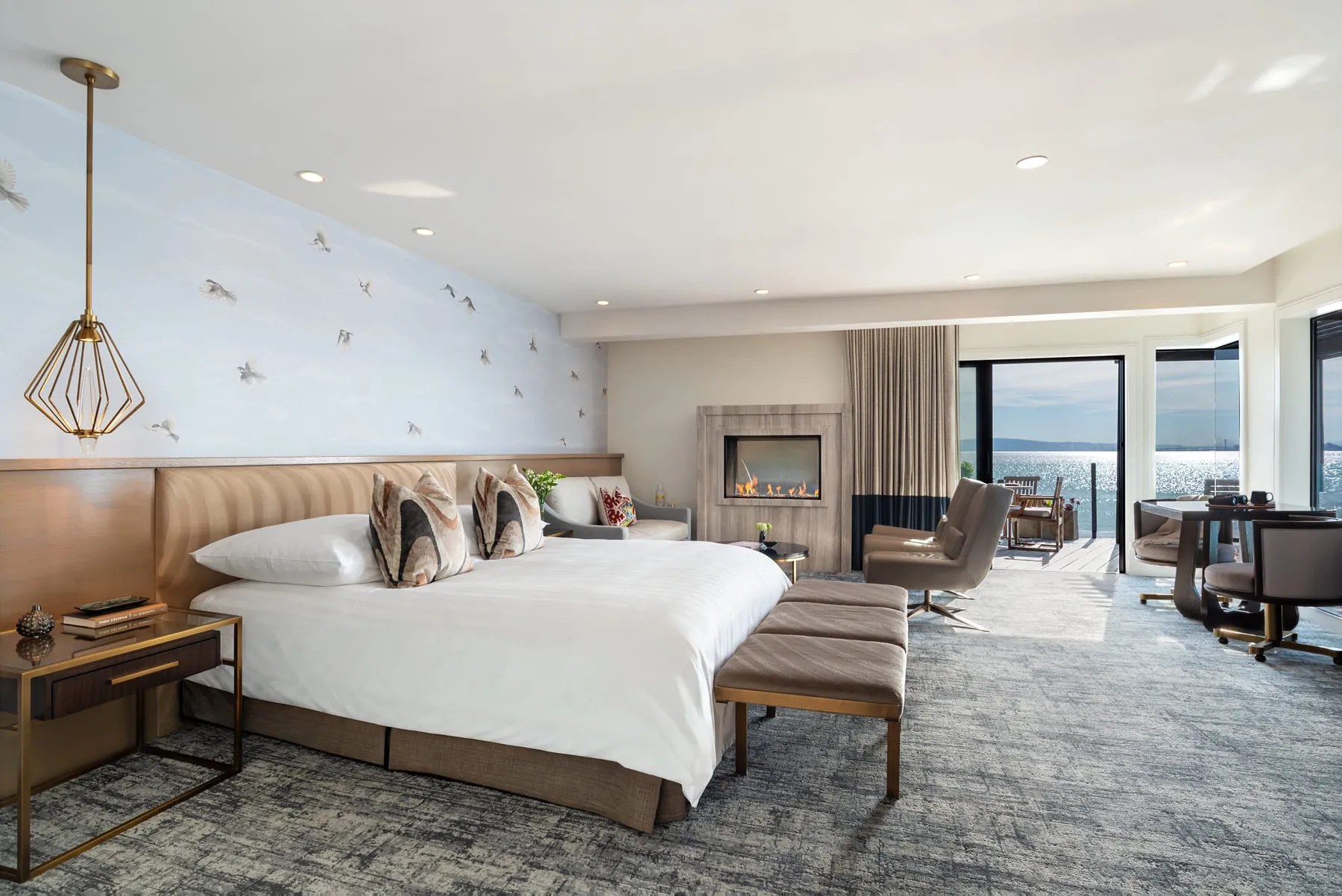 Spacious guest suite at this Sausalito hotel with king bed, fireplace, and deck overlooking the bay